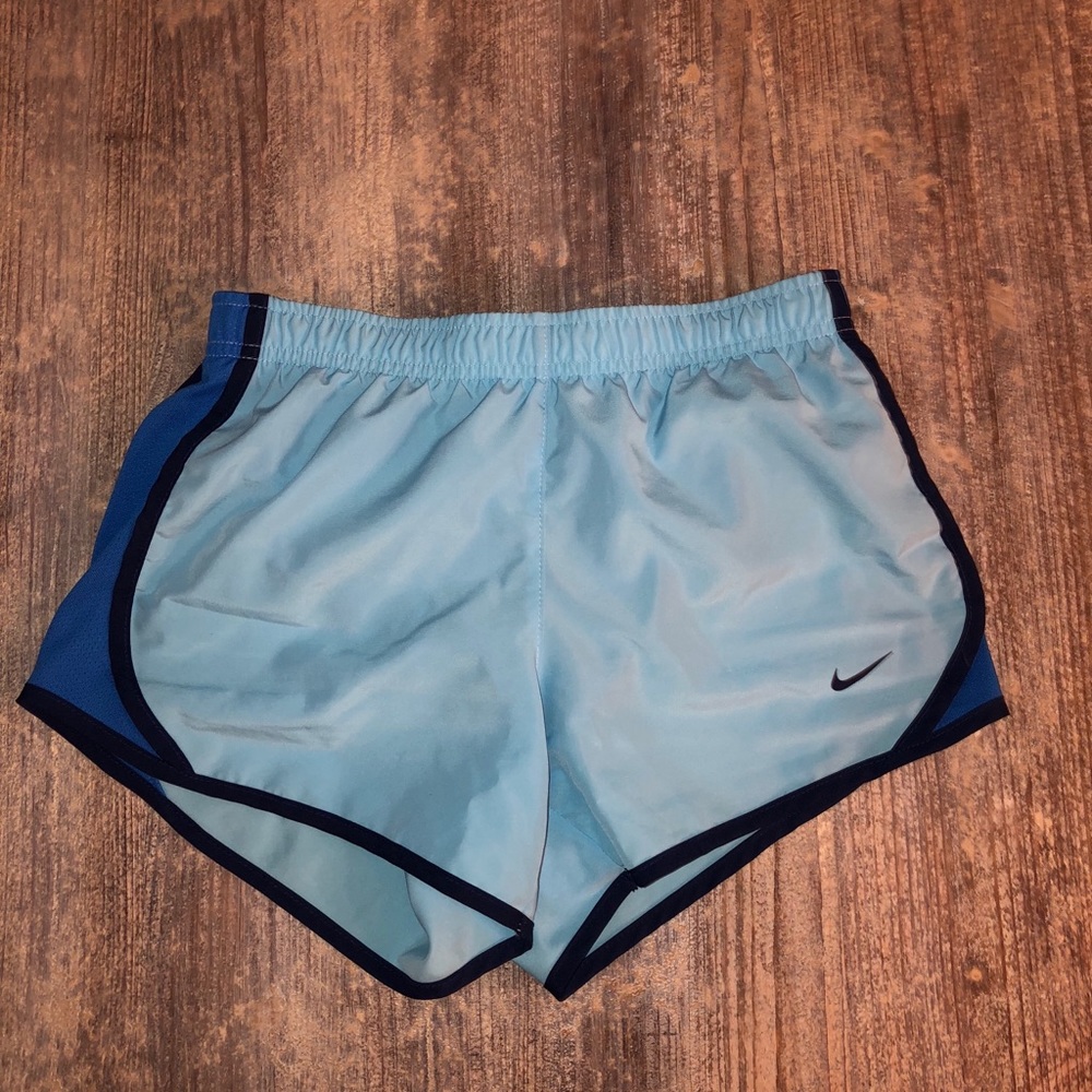 Blue Nike running shorts
